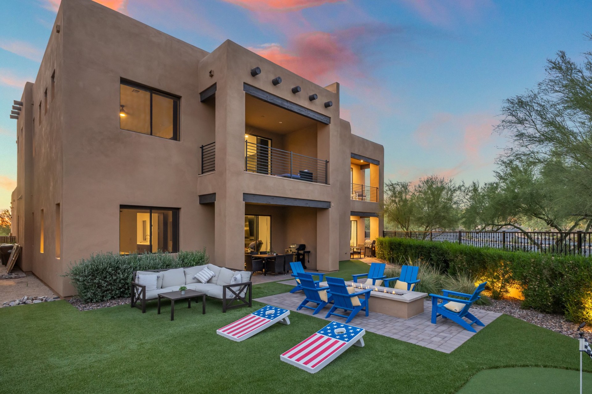 Exterior lawn and fire pit at Villas at Troon North at sunset