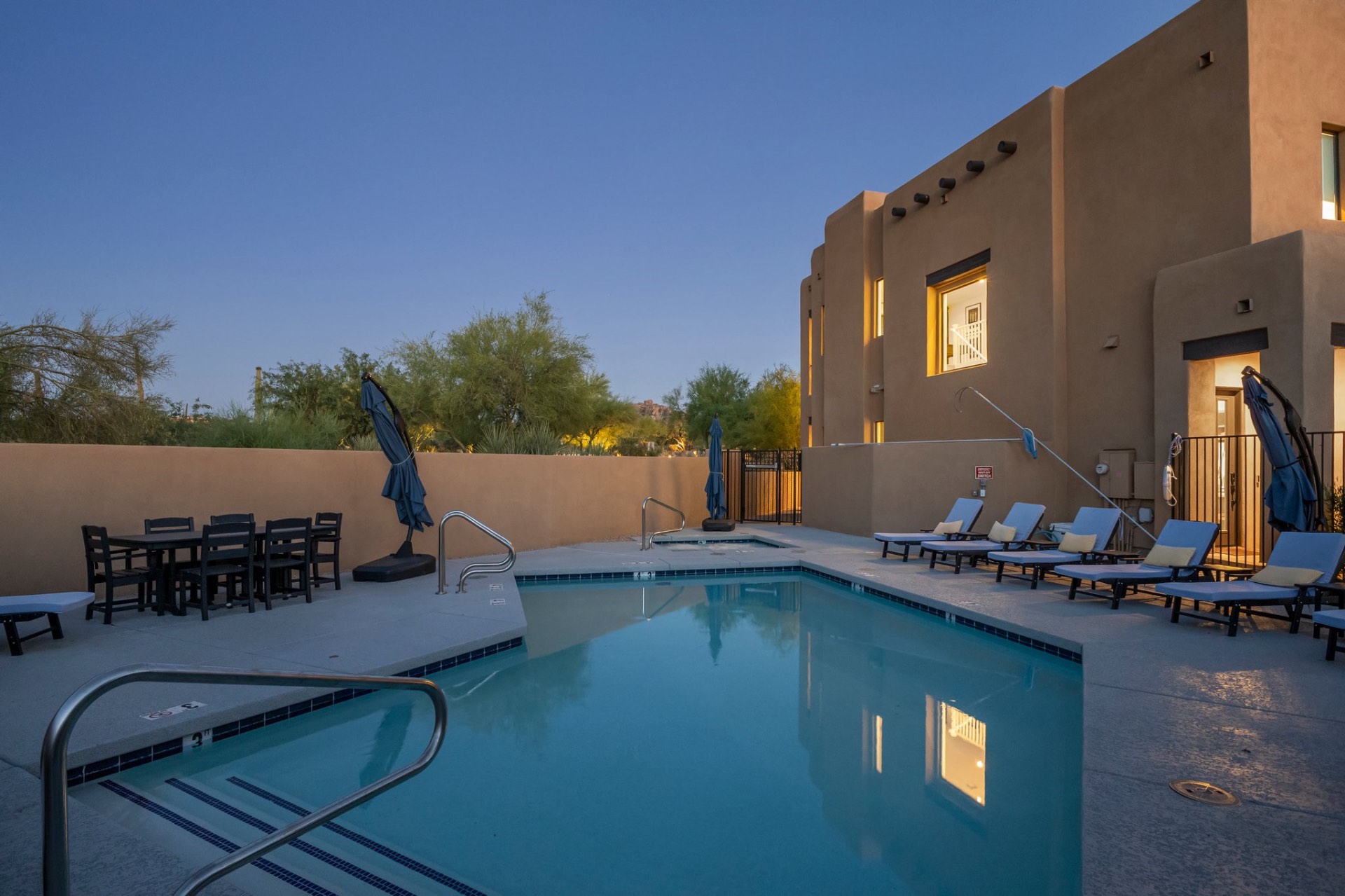 Private resort-style pool at dusk beside the villa